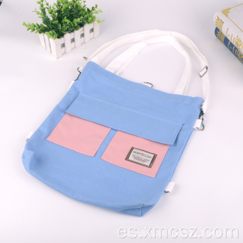 Bolso tote cruzado con letras azules y bolsillo